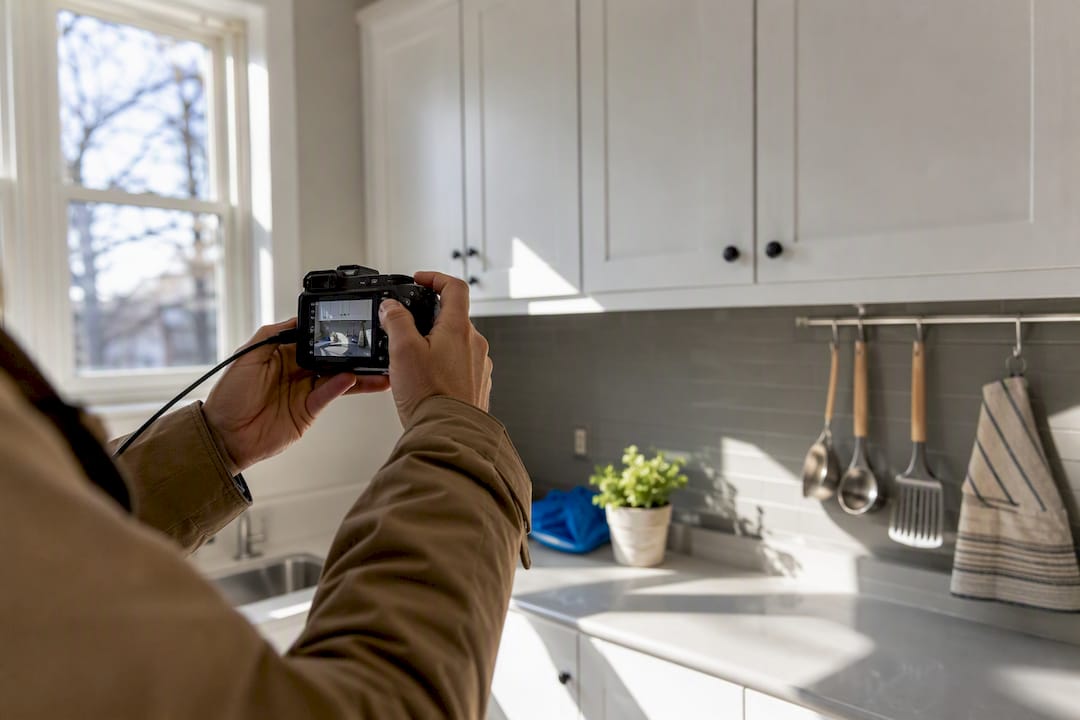 Landlord photographing rental property door lock