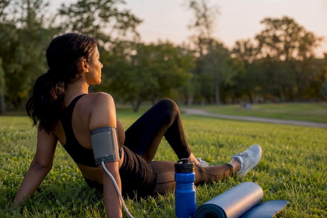 Arm with blood pressure cuff resting after exercise