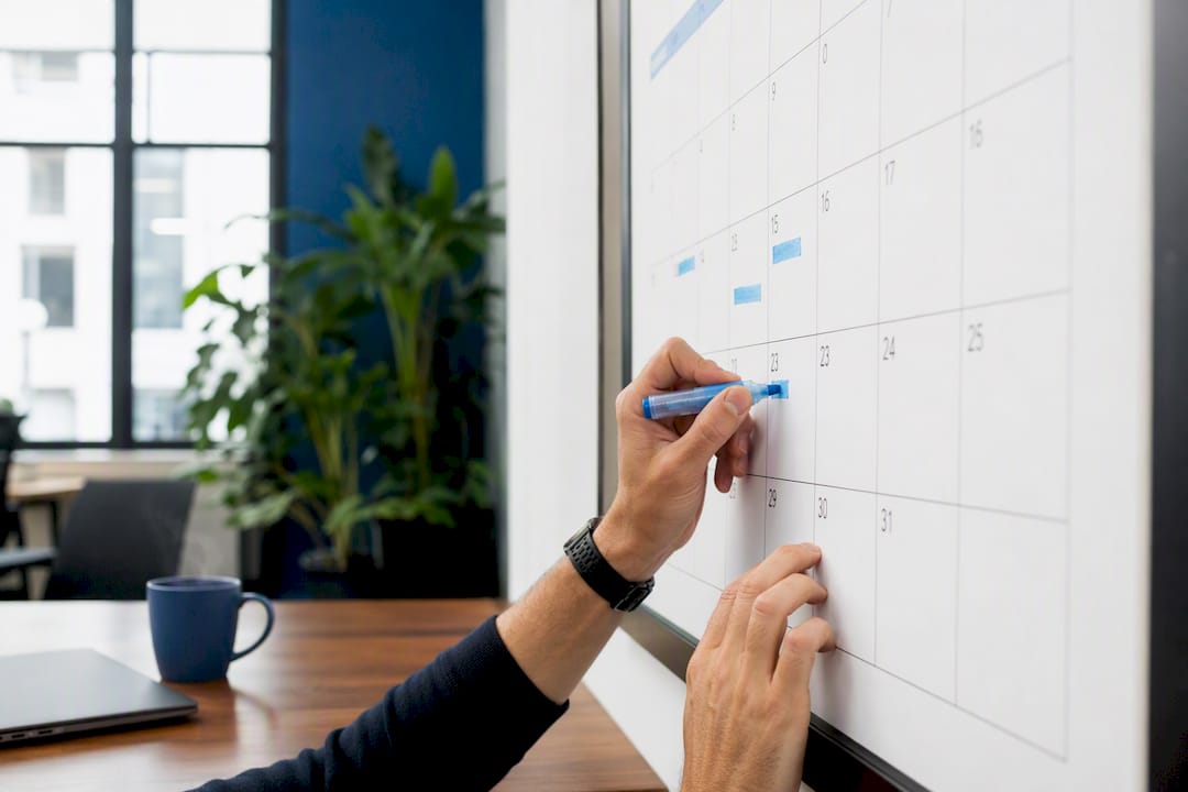 Hands marking calendar for subscription billing