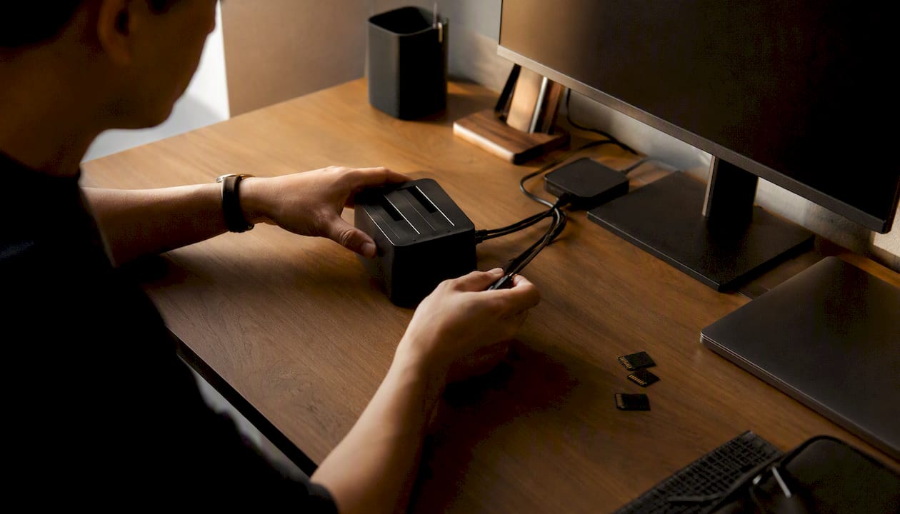 Hands connecting storage devices for video files