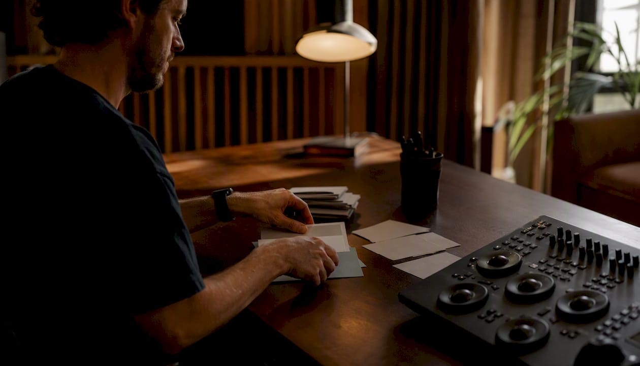 Hands preparing color grading reference frames