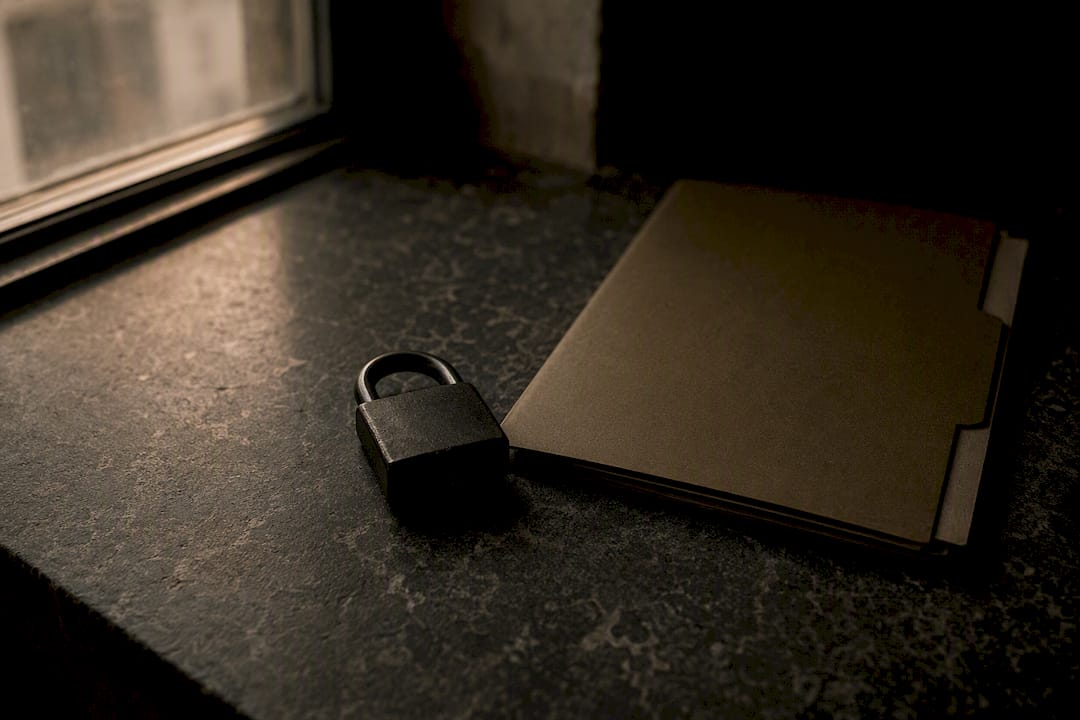 Padlock next to video file folder on desk