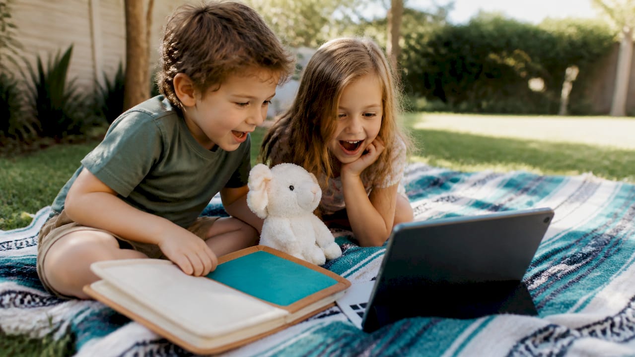 Children learning through a video lesson at home