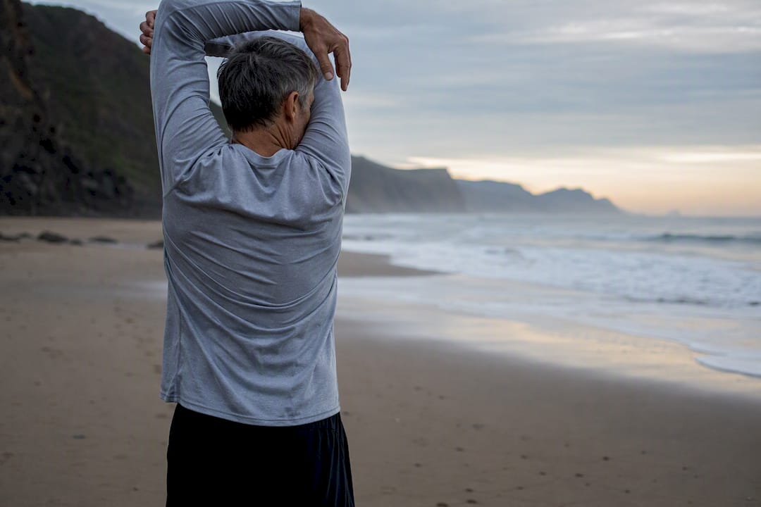 Man stretching in morning park exercise