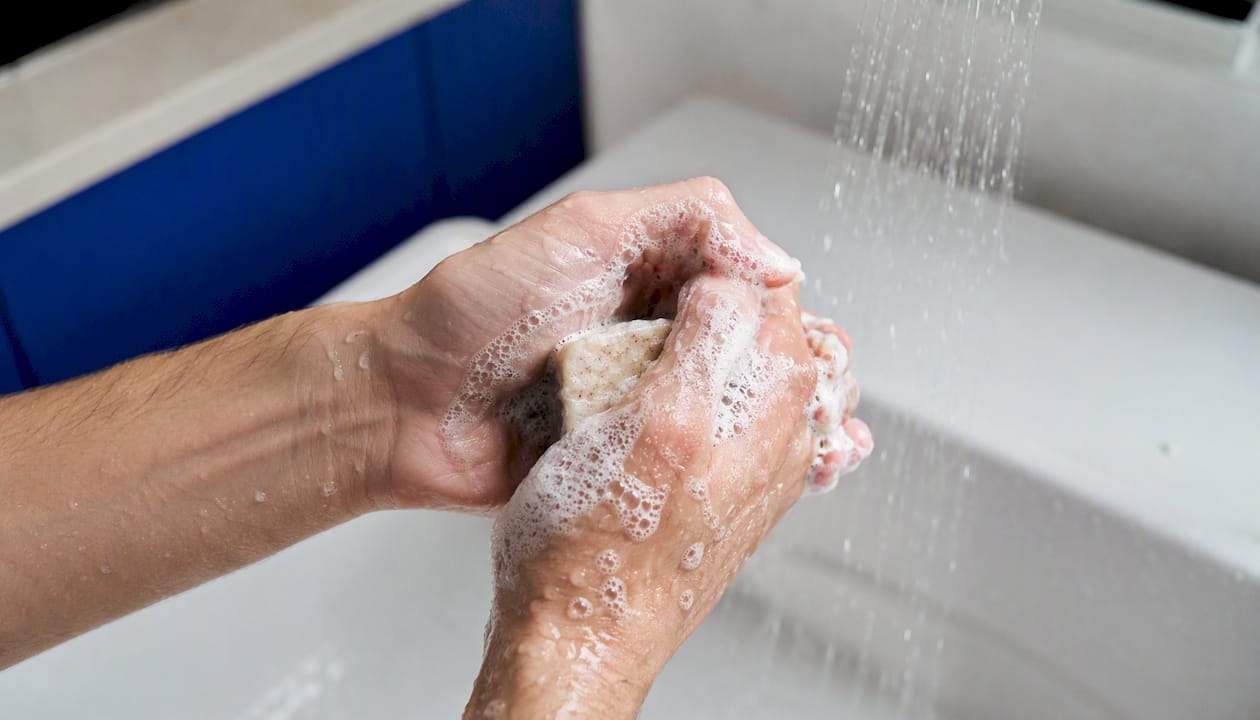 Close-up of foam from soap-based shampoo bar under water