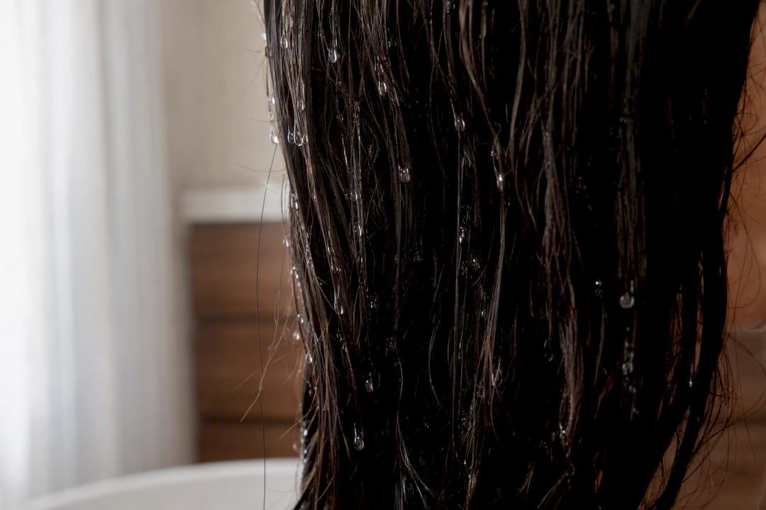 Water droplets on low porosity hair strand