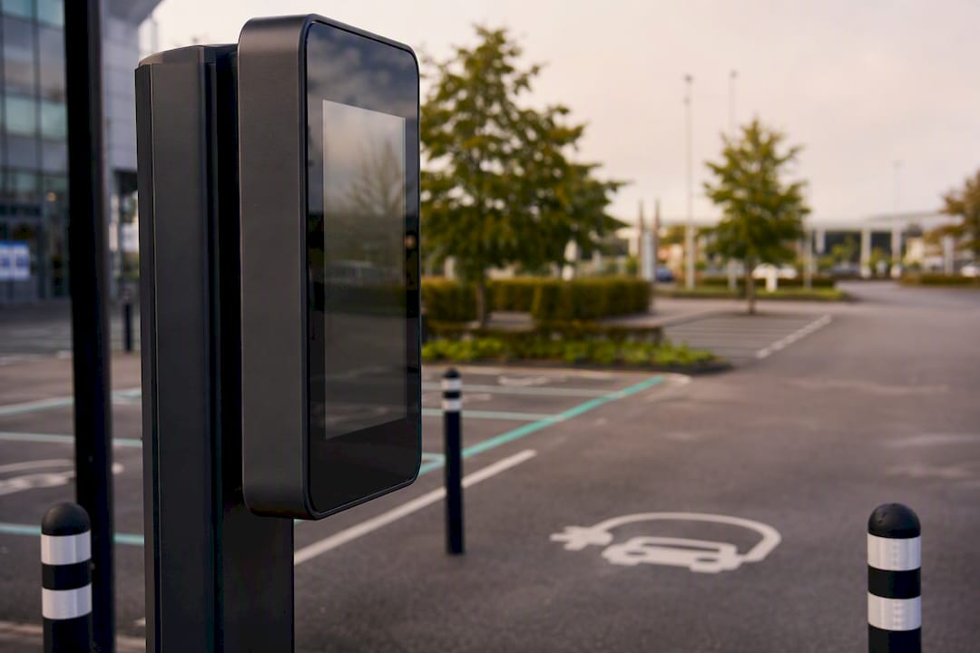 Digital EV charging sign at commercial car park entrance