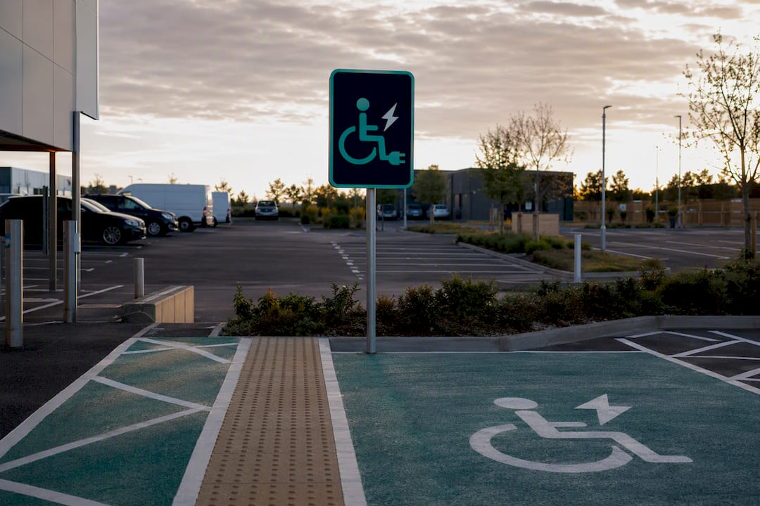 Accessible EV charging bay sign with high-contrast design