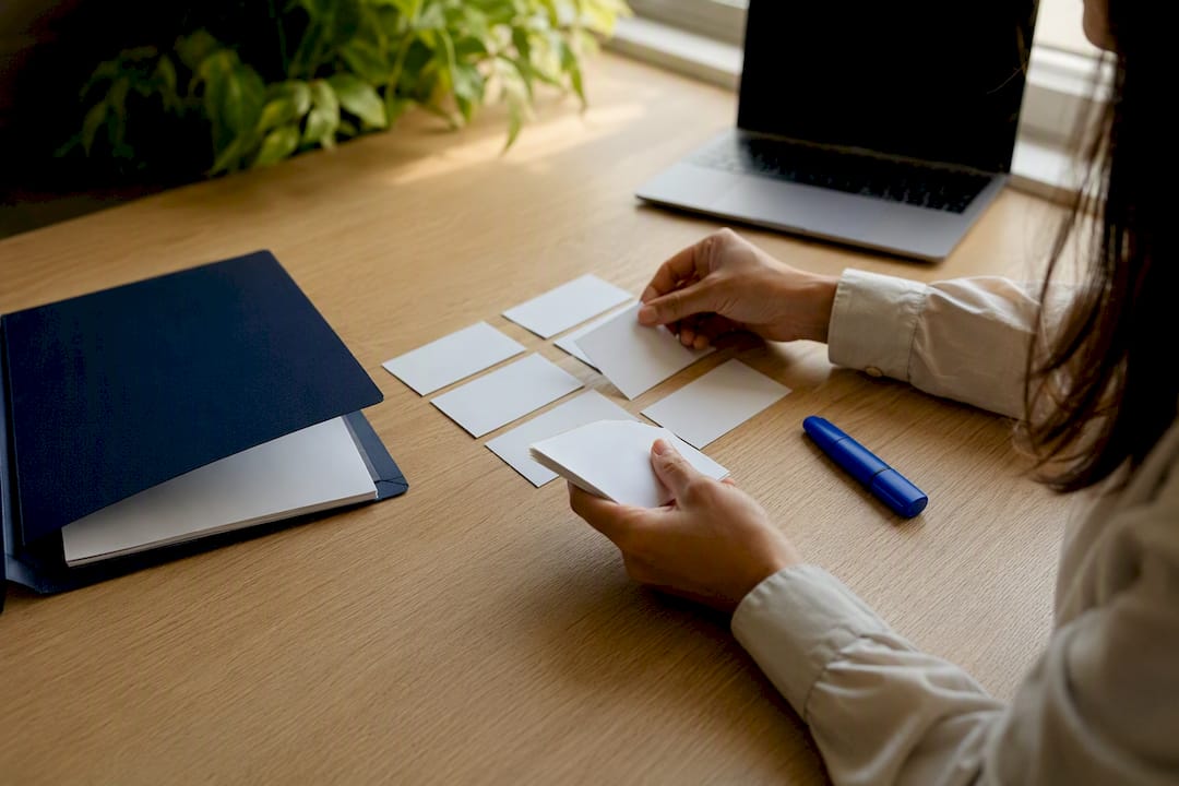 Hands sorting insurance lead cards