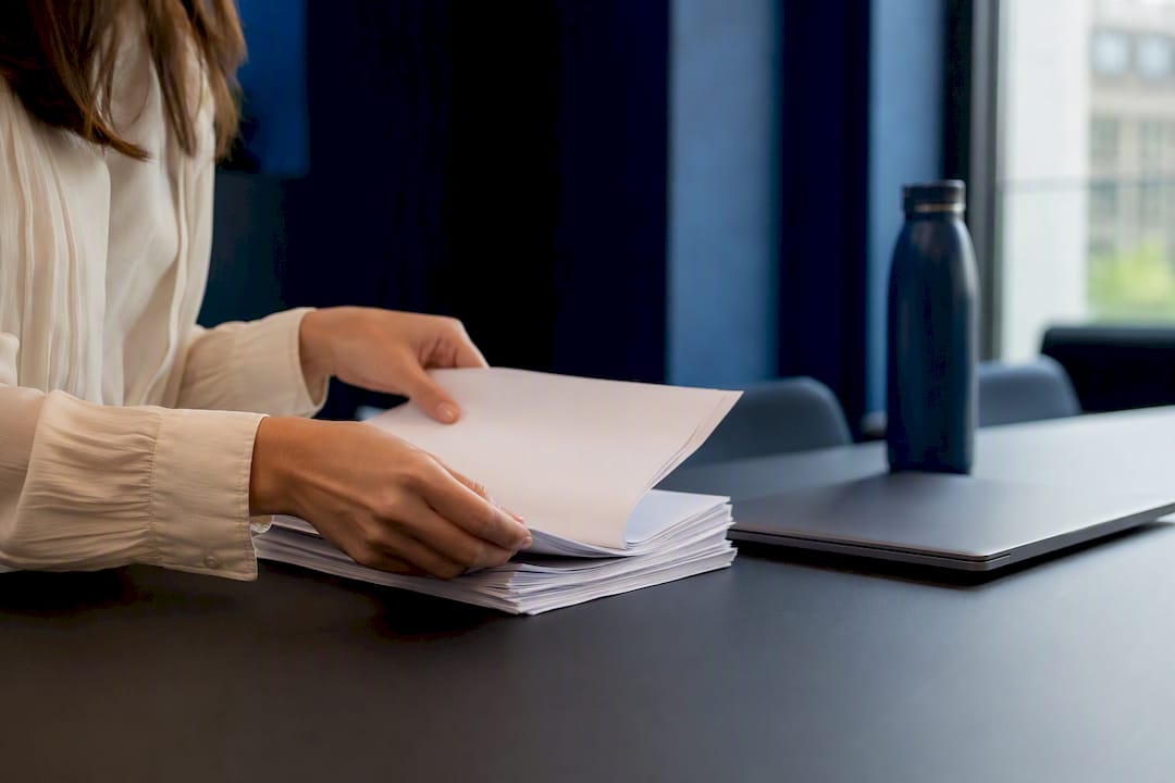 Hands adjusting contract binder