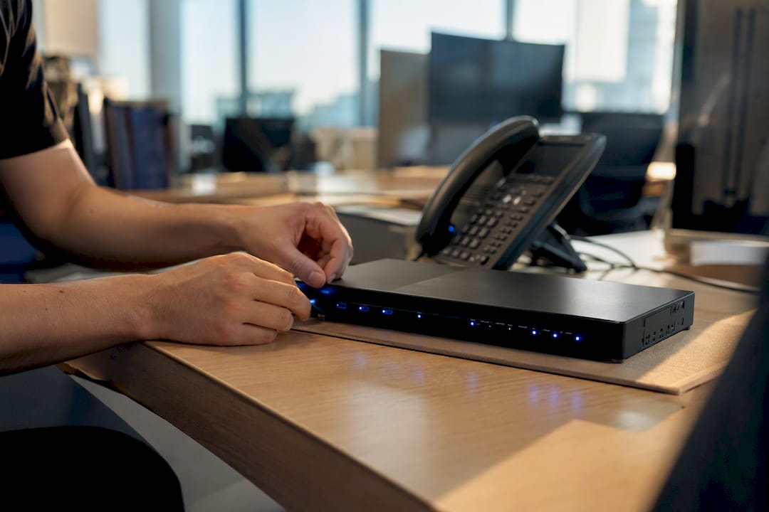 Hands configuring automation device