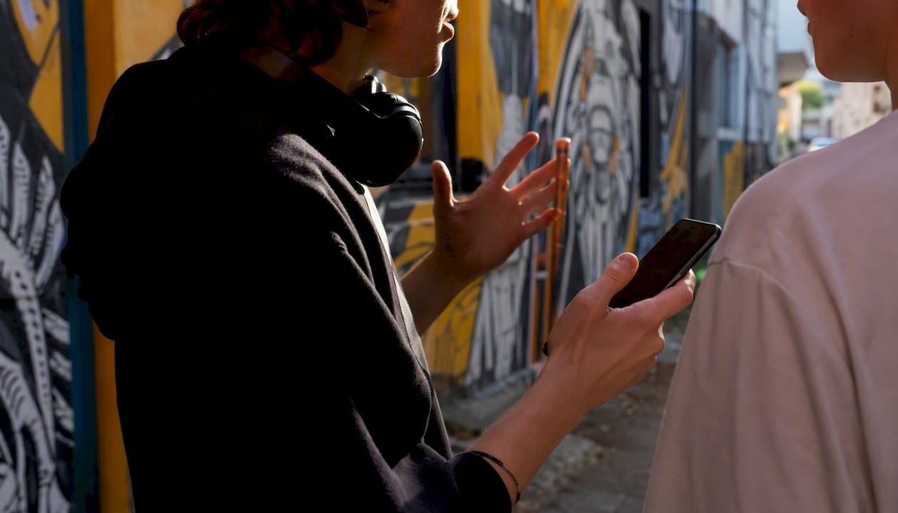 Hands of musicians sharing music brief outdoors