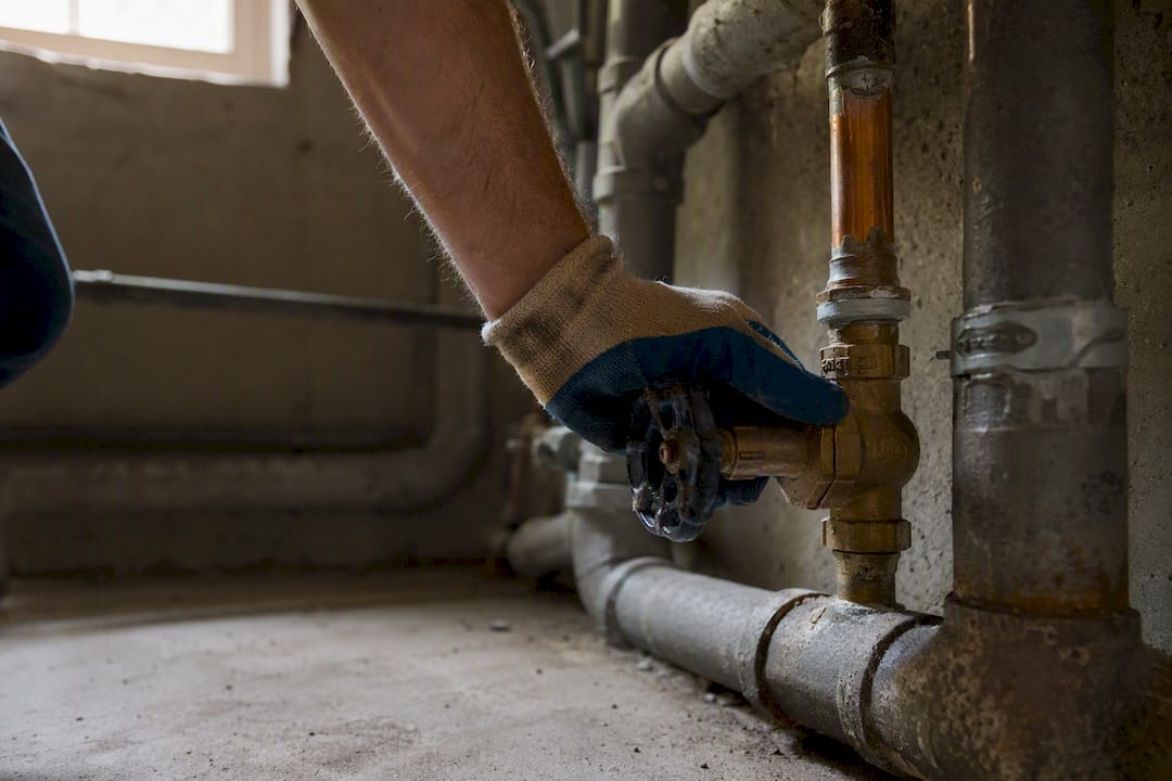 Hand turning main water shutoff valve