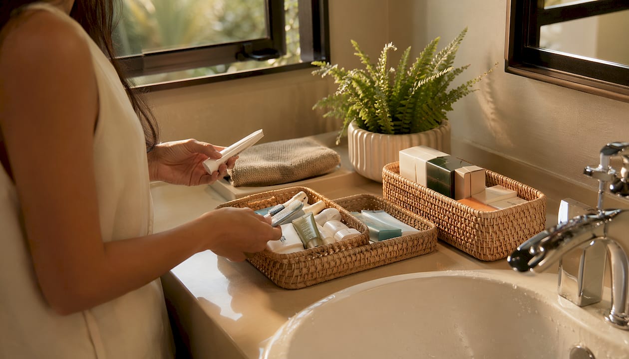 Hands sorting and categorizing bathroom products