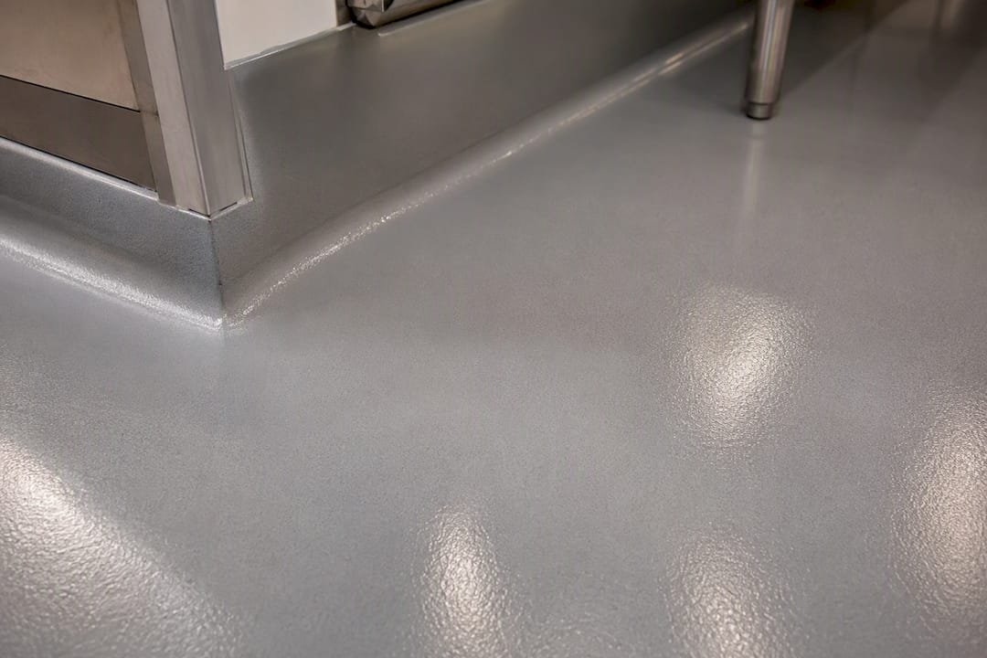 Seamless urethane cement floor with integral cove base