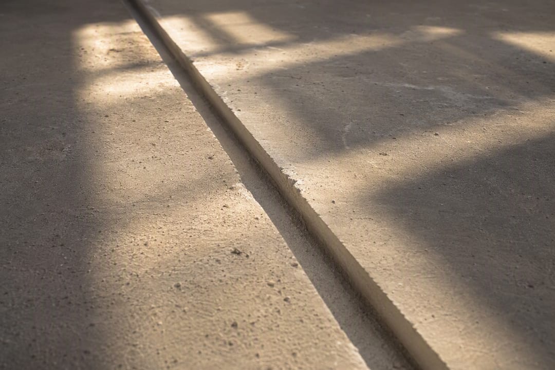 Clean routed groove in concrete floor crack