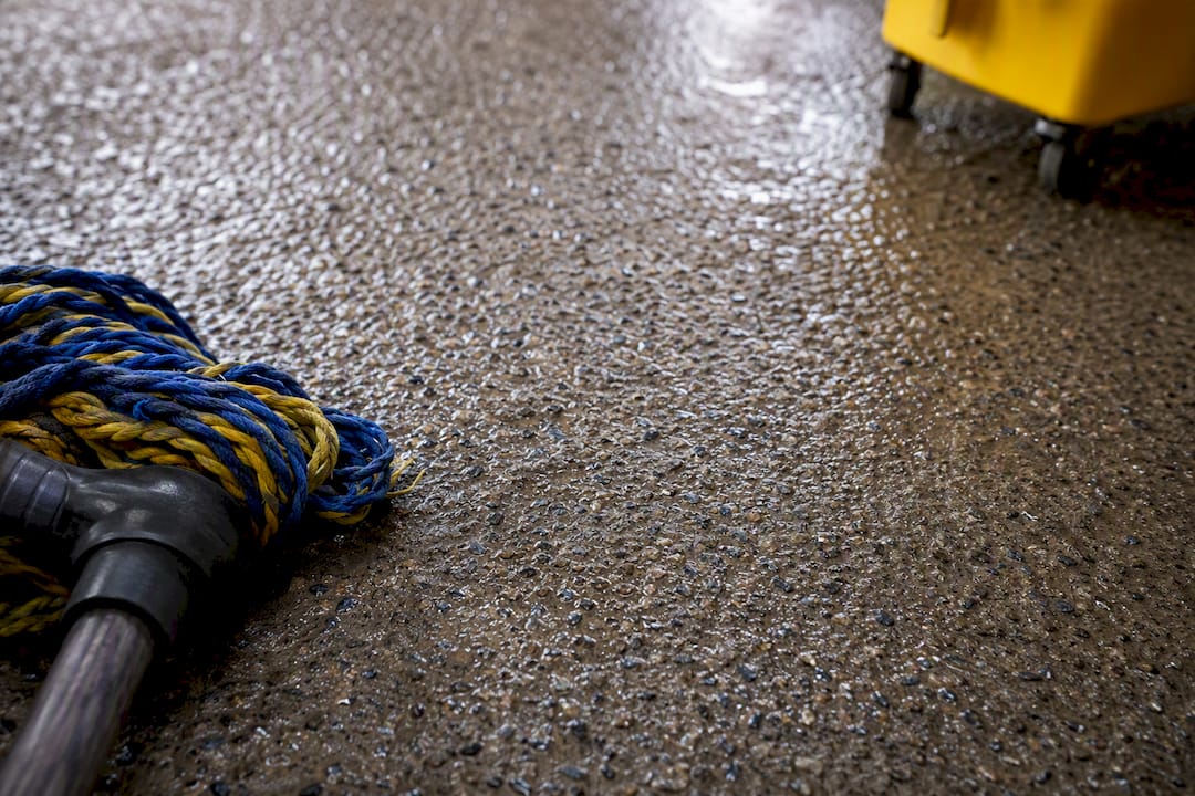 Grime settling into textured epoxy floor