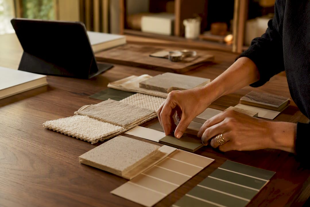 Hands assembling interior design presentation board