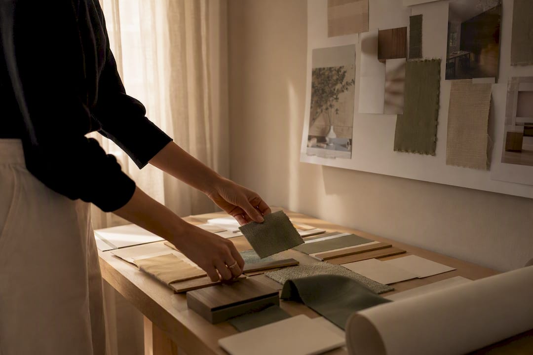 Hands arranging material and concept samples