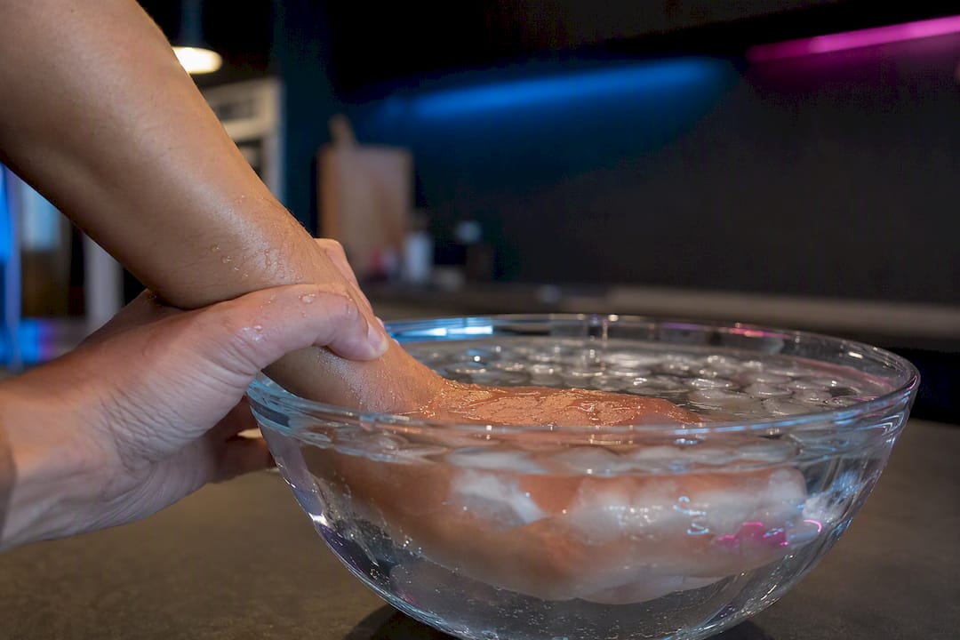 Cold water running over wrist for grounding