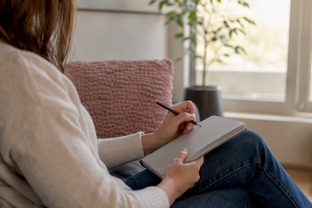 Hands writing exposure therapy script