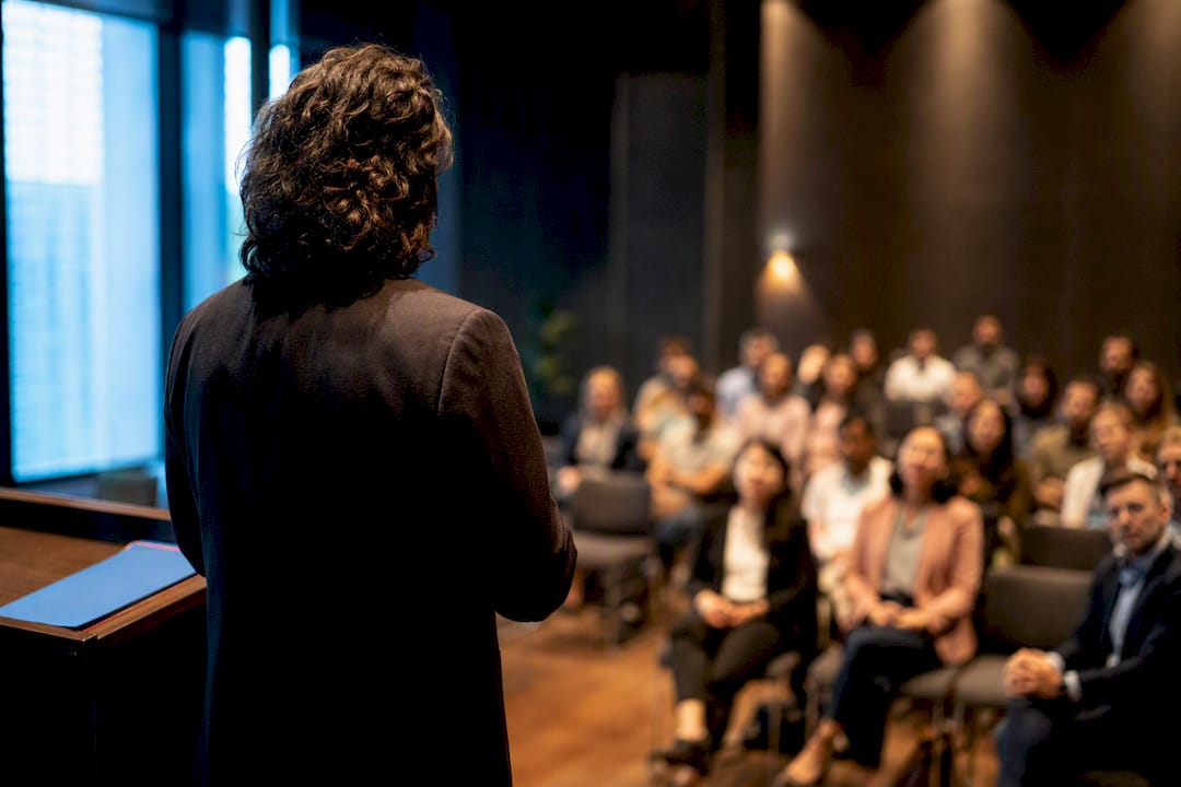 Speaker facing audience before a talk