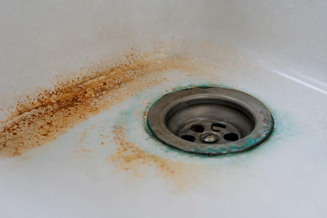 Copper corrosion and rust stains in sink