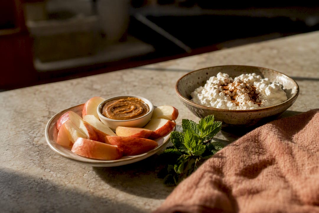 Healthy PCOS snacks apple with almond butter and cottage cheese