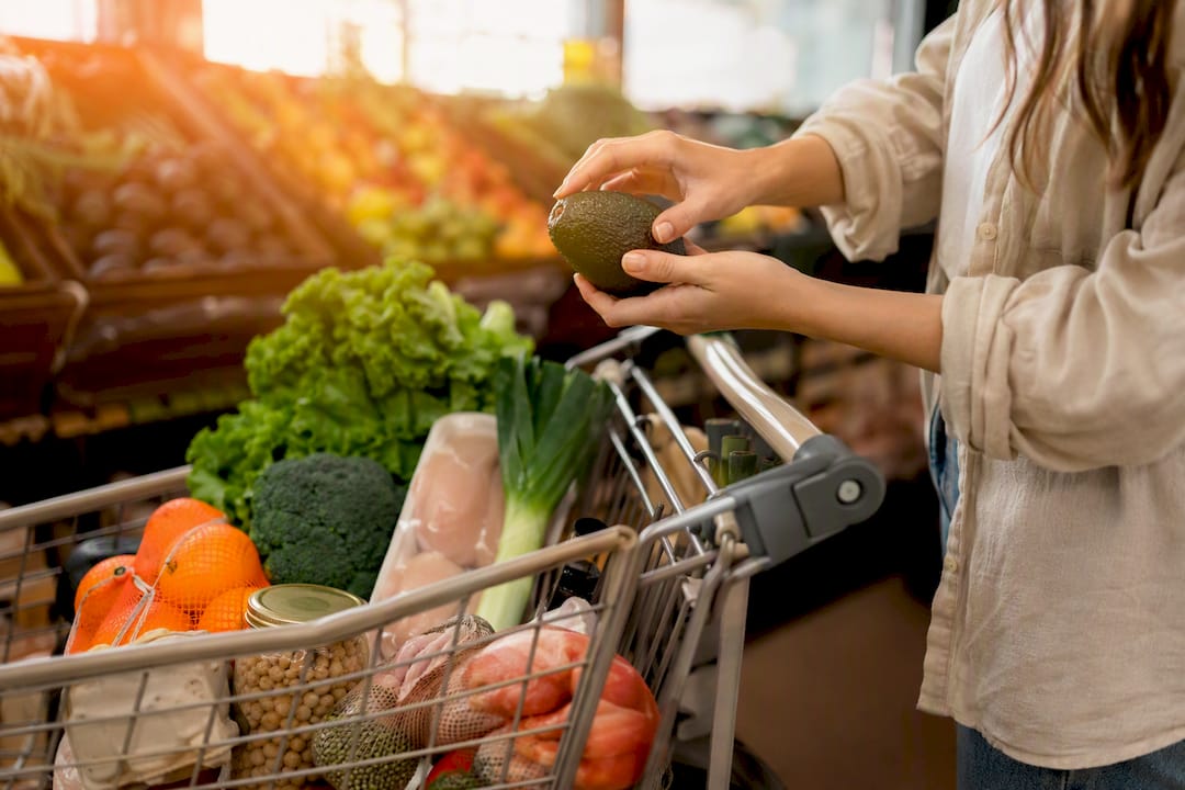 Shopping cart filled with fresh low sodium foods