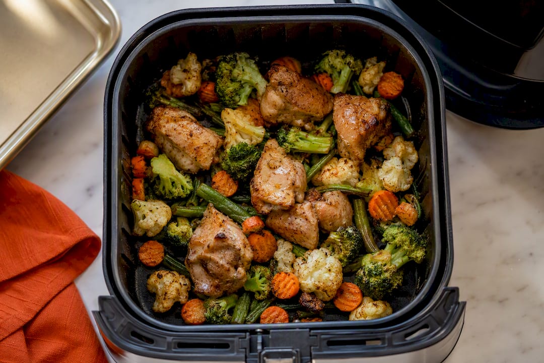 Crisp vegetables in air fryer basket