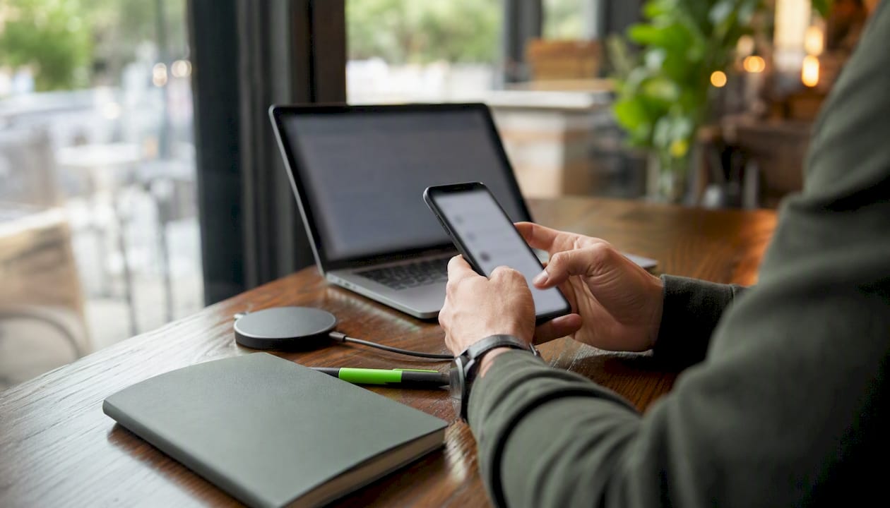 Hands holding smartphone for digital PR outreach