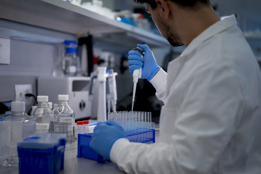 Scientist pipetting samples for validation study