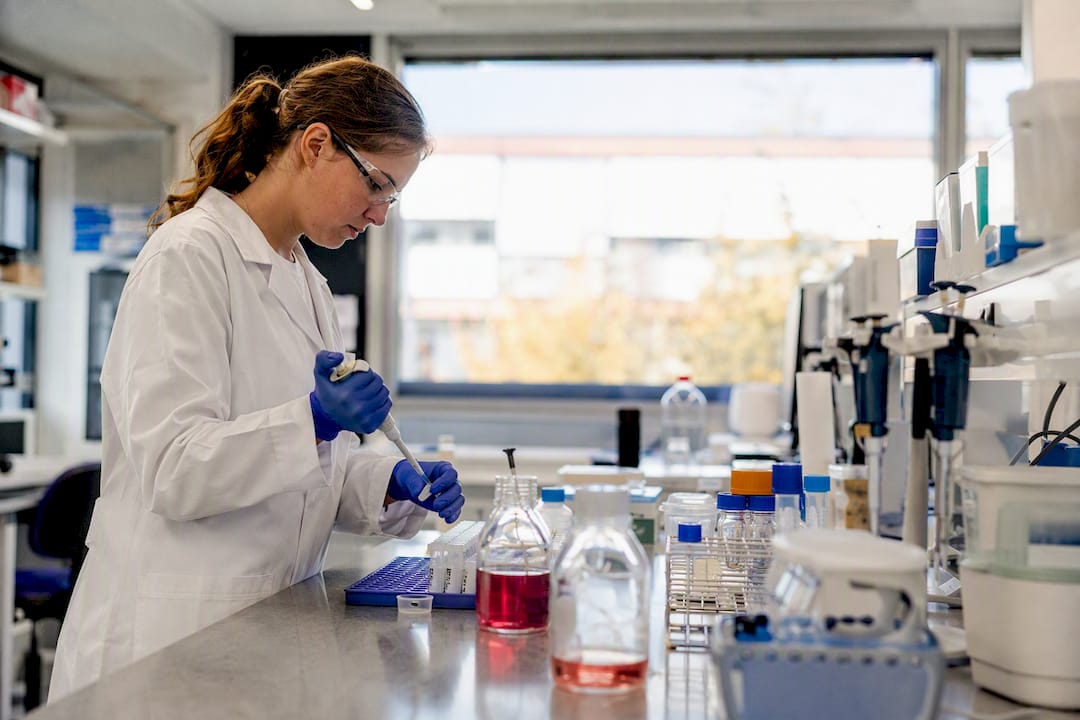 Scientist pouring blocking buffer solution
