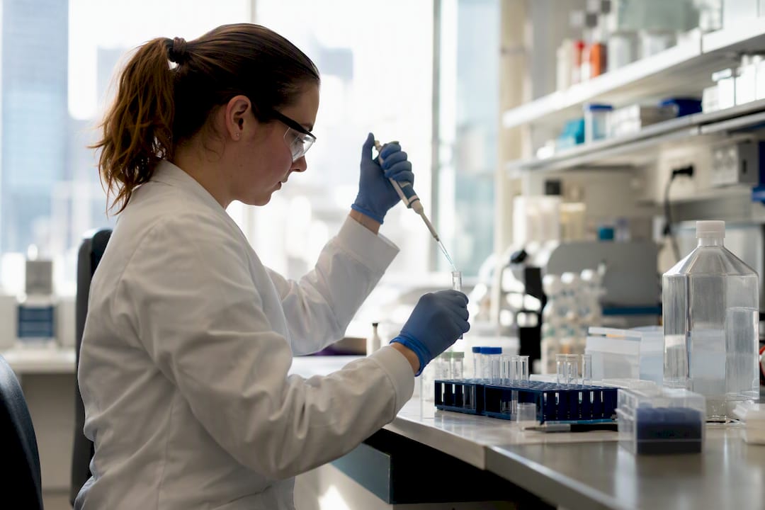 Scientist pipetting single-color control reagent