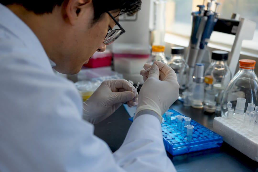 Scientist attaching protein tag in lab