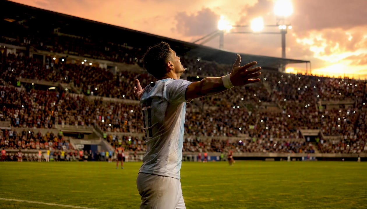 Football player celebrating a goal mid-action