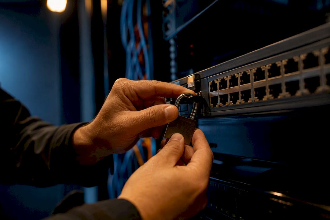 Hands securing network hardware lock
