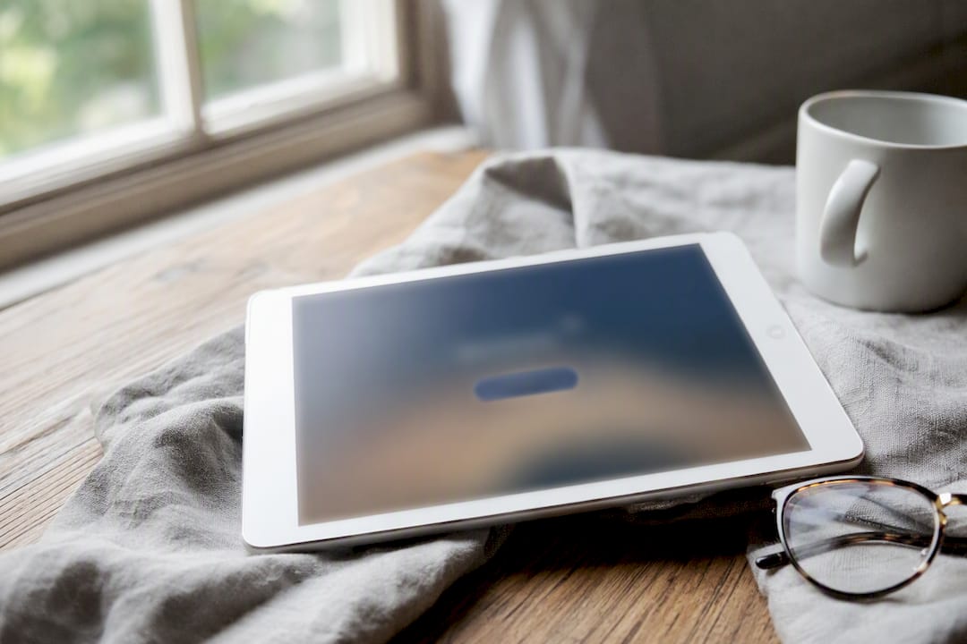 Tablet showing single clear CTA button on minimalist webpage