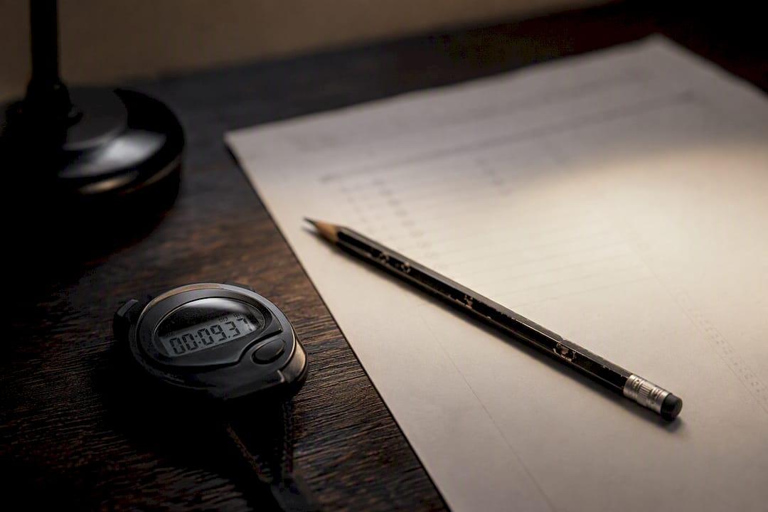 Stopwatch and test sheet implying test anxiety