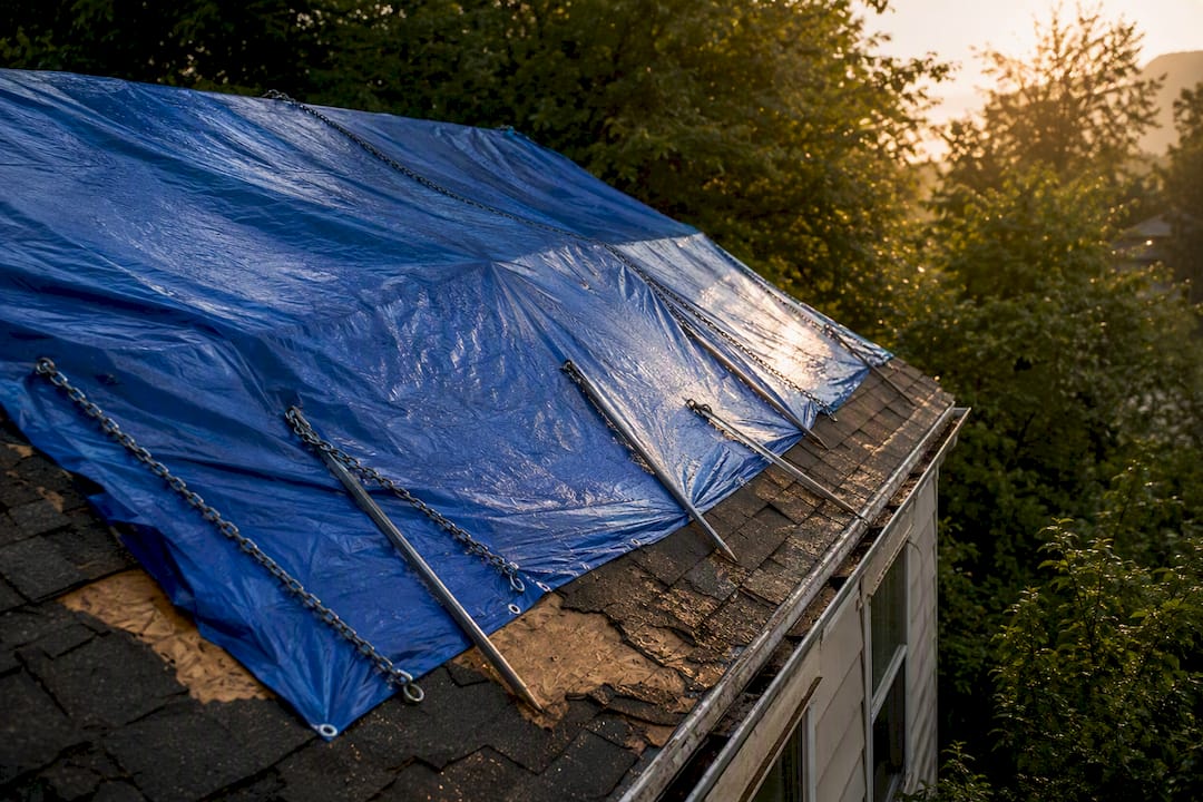 What to Do About an Emergency Roof Tarp After Storm Damage