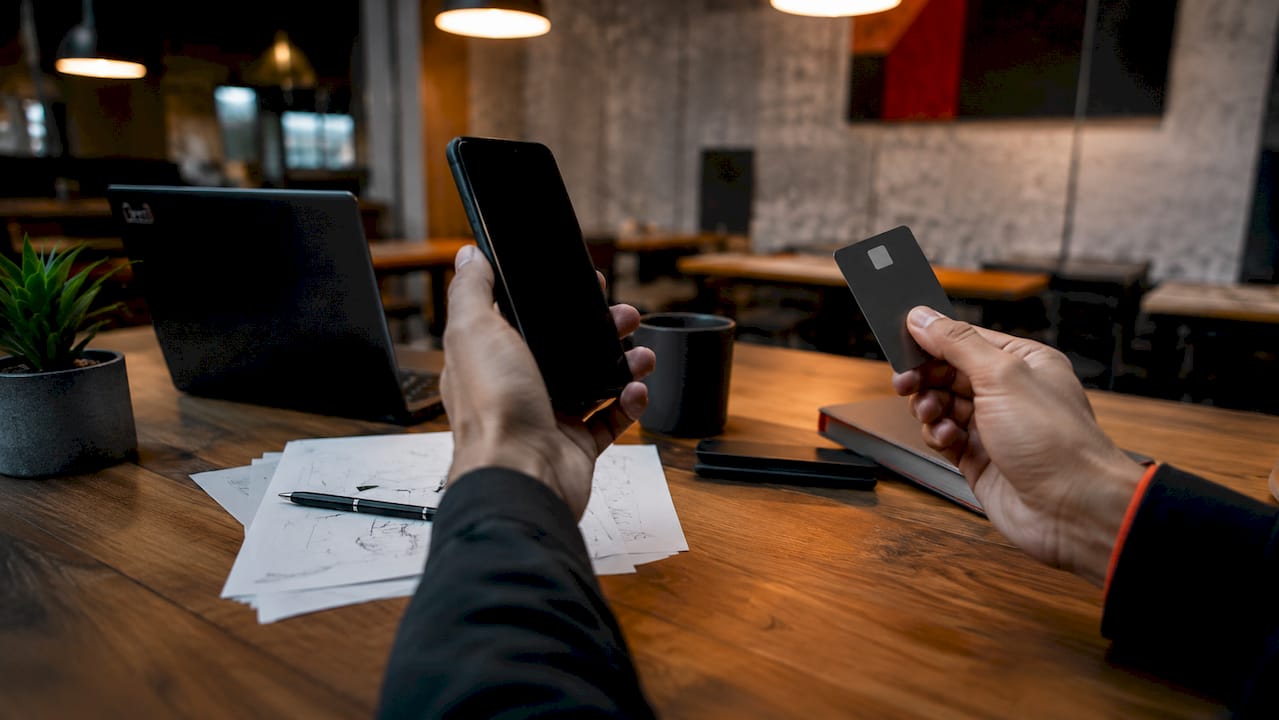 Hands holding smartphone and keycard illustrating control types