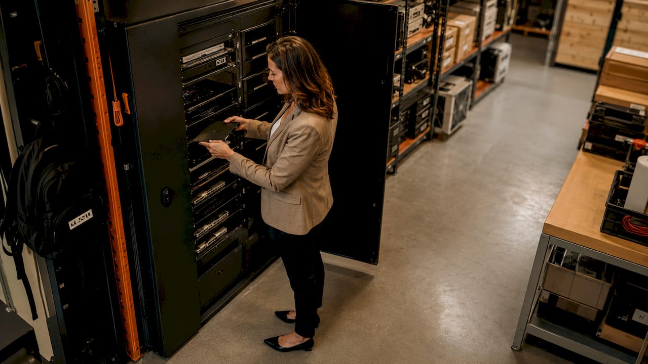 IT manager accessing smart locker in server room