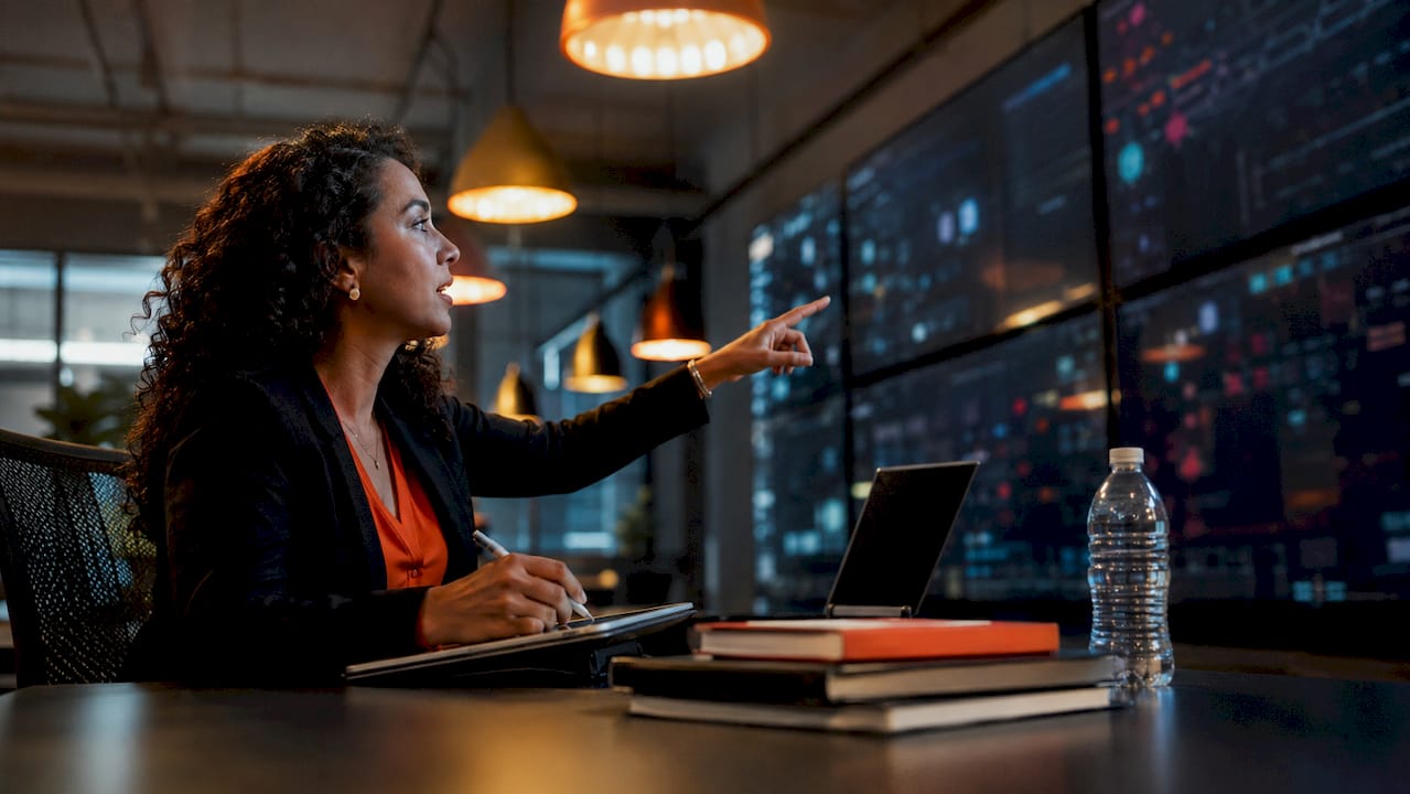 IT specialist monitoring AI powered support systems