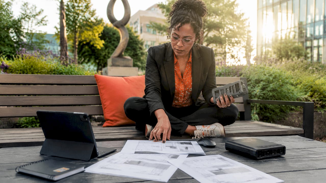 CIO examining physical IT devices at desk