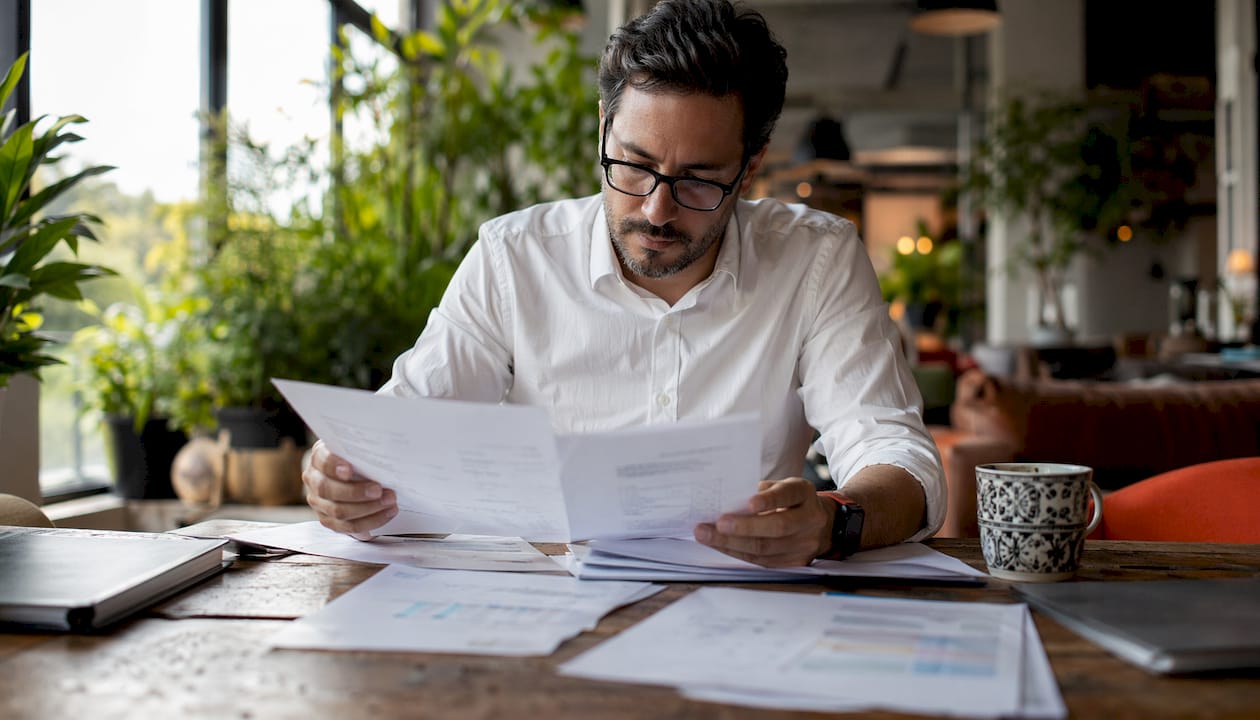 IT manager reviewing field engineer cost reports