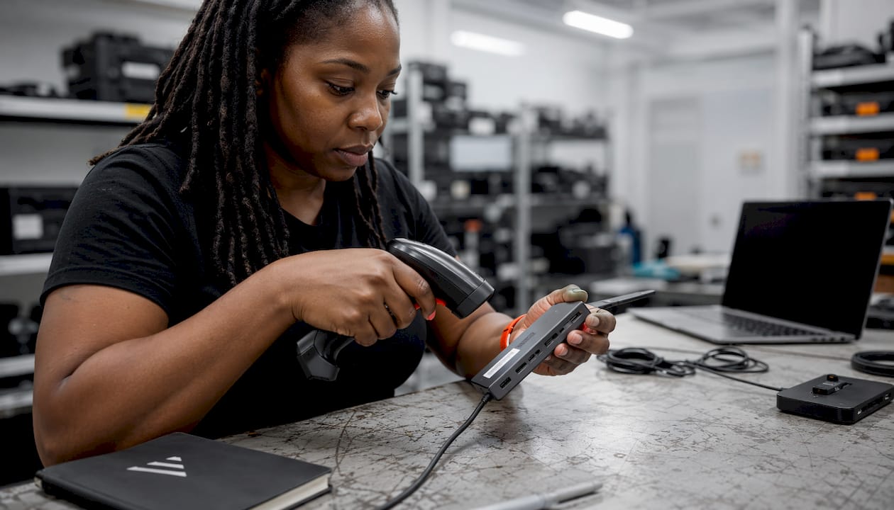 Technician scanning peripheral serial number
