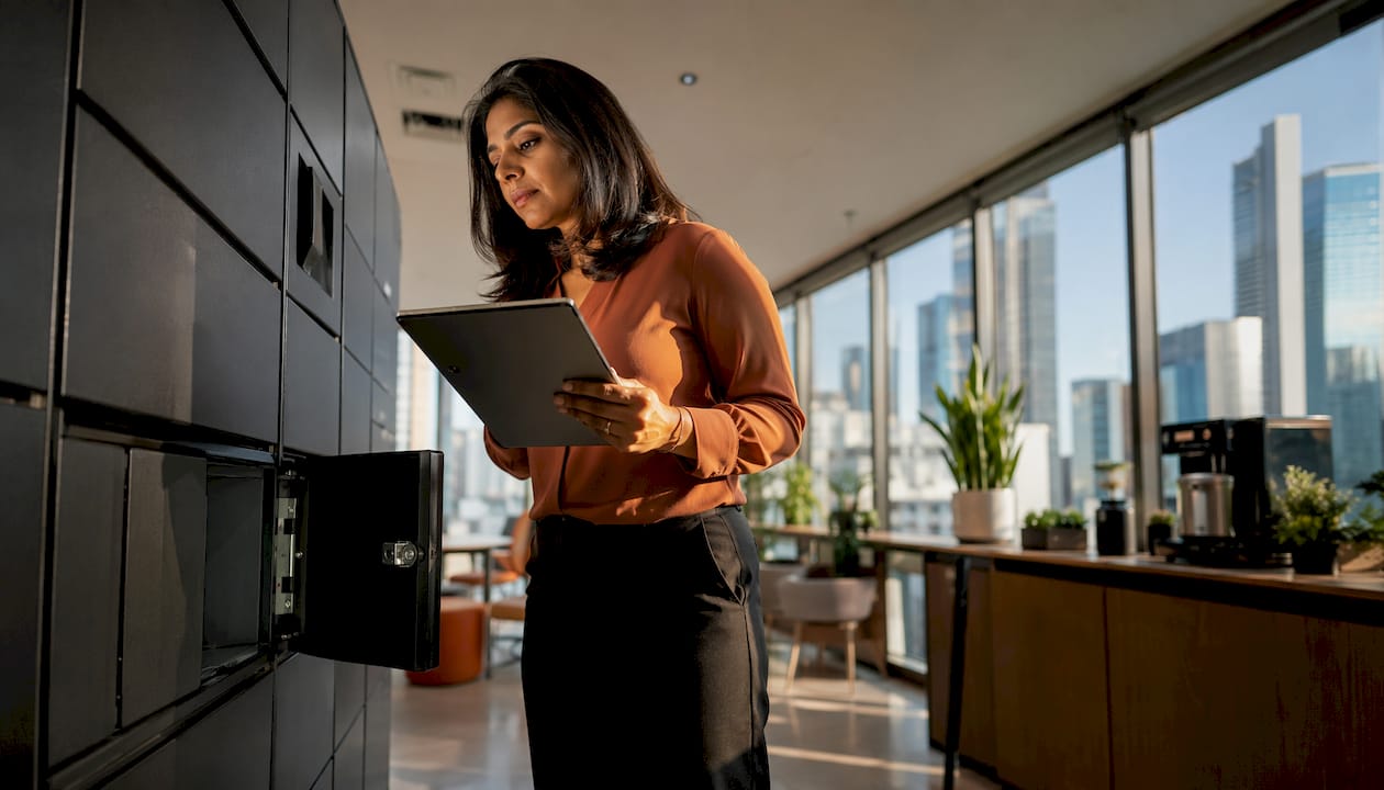 IT manager inspecting smart locker unit