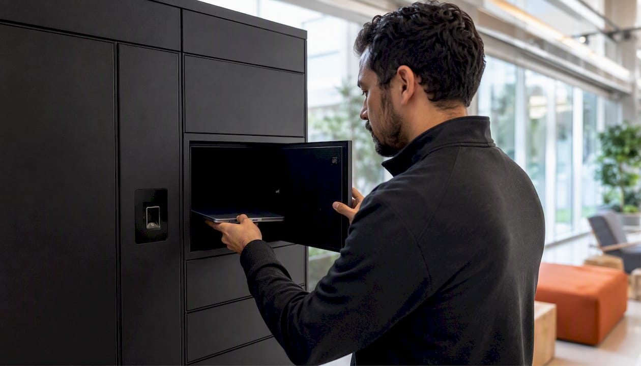 Hands opening smart locker with device inside