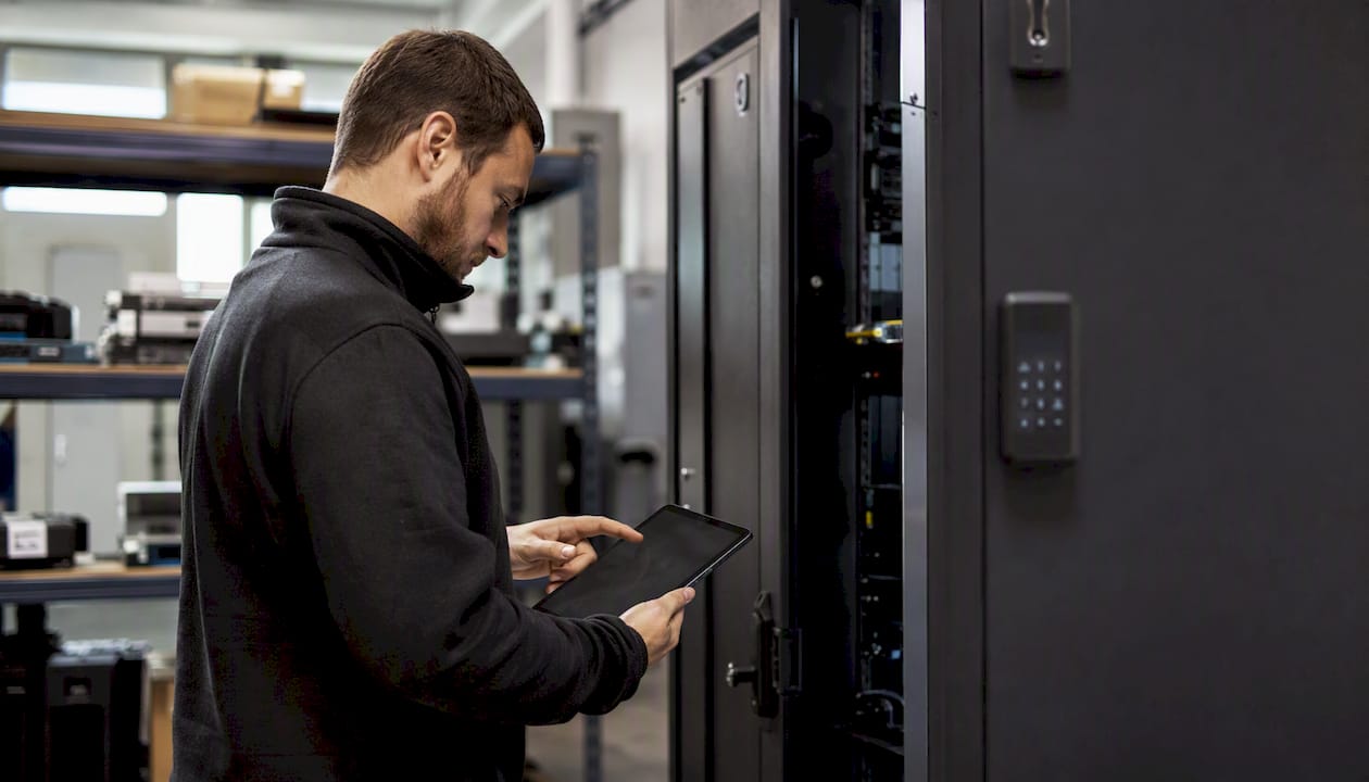 Hands opening secure IT device locker