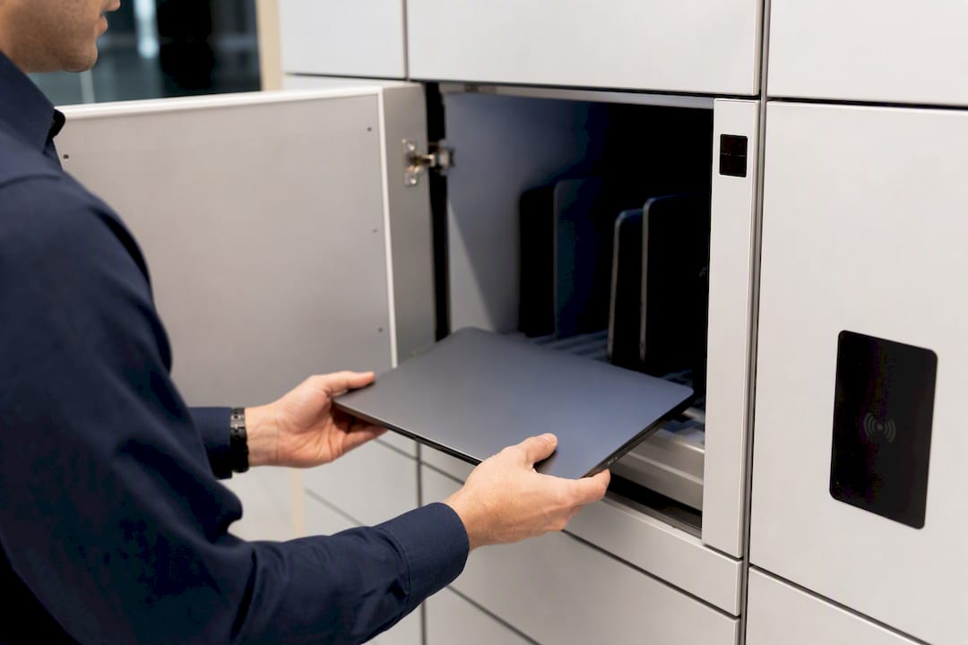 Hands placing device in smart locker compartment